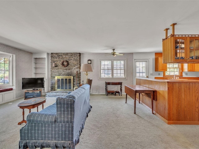 154 Birchcliff Pkwy, Burlington, VT 05041 - living room featuring wallpapered walls, plenty of natural light, light carpet, ceiling fan, and a brick fireplace