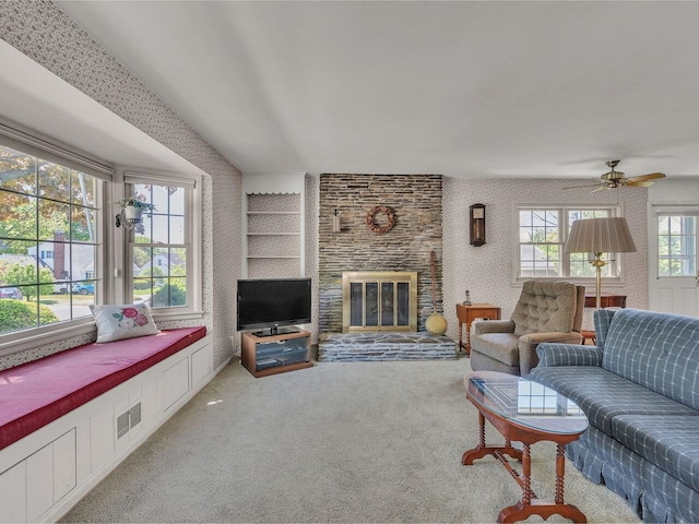 154 Birchcliff Pkwy, Burlington, VT 05041 - living area with a brick fireplace, light colored carpet, ceiling fan, and wallpapered walls