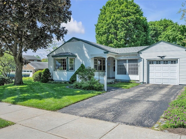 154 Birchcliff Pkwy, Burlington, VT 05041 - ranch-style home featuring an attached garage, a porch, a front yard, driveway, and roof with shingles