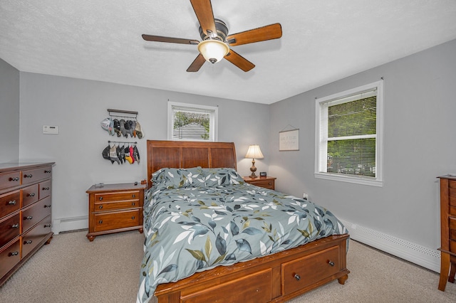 28 Hardy Rd, Londonderry, NH 03053 - bedroom featuring light carpet, a baseboard radiator, and a ceiling fan