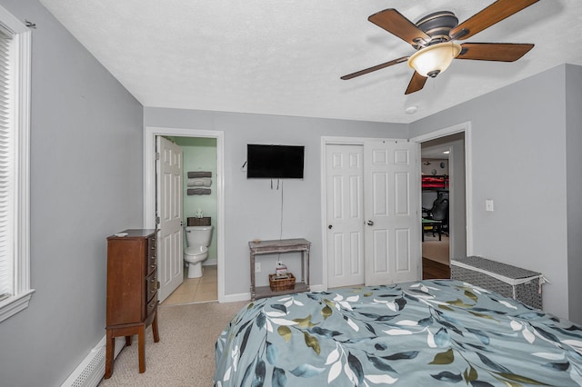 28 Hardy Rd, Londonderry, NH 03053 - carpeted bedroom featuring a closet, a baseboard heating unit, ensuite bathroom, ceiling fan, and baseboards