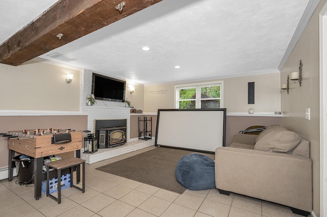 28 Hardy Rd, Londonderry, NH 03053 - living area with light tile patterned floors, ornamental molding, recessed lighting, and a wood stove