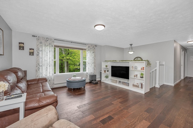 28 Hardy Rd, Londonderry, NH 03053 - living room featuring dark wood-type flooring, a baseboard radiator, and a textured ceiling