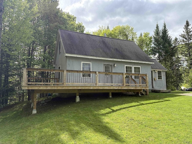 10 Youngs Rd, East Haven, VT 05837 - rear view of property featuring a wooden deck, roof with shingles, and a lawn