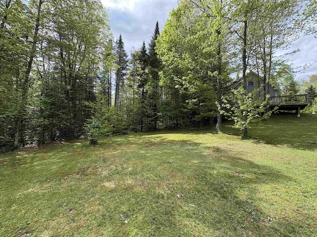 10 Youngs Rd, East Haven, VT 05837 - view of grassy yard featuring a wooden deck