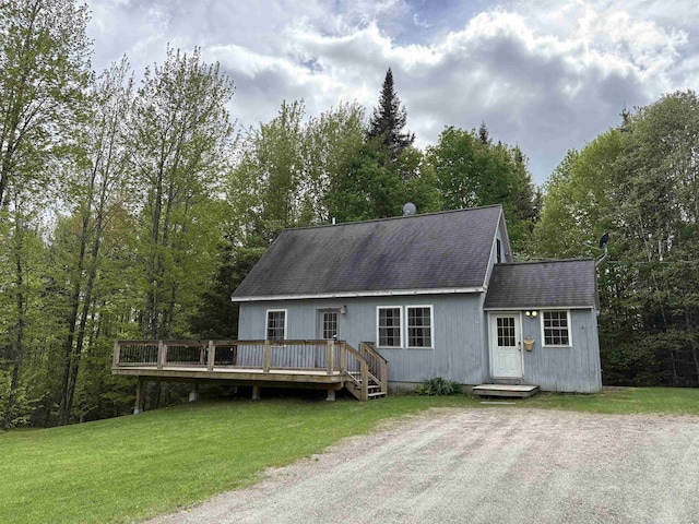 10 Youngs Rd, East Haven, VT 05837 - view of front of house featuring roof with shingles, a deck, and a front lawn