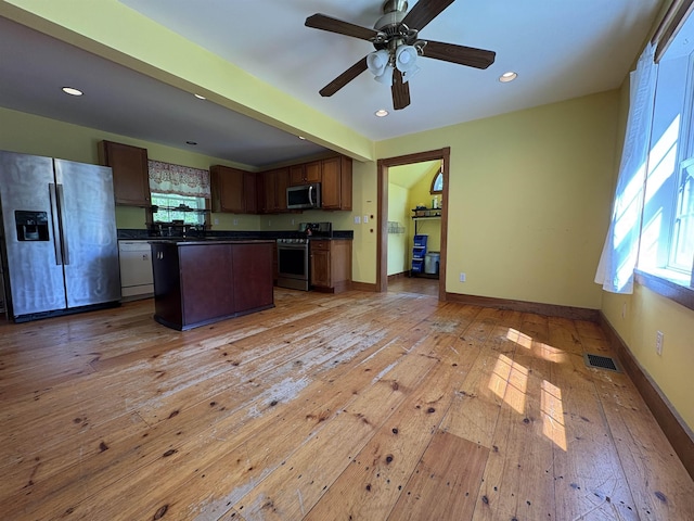 10 Youngs Rd, East Haven, VT 05837 - kitchen with stainless steel appliances, dark countertops, light wood finished floors, recessed lighting, and ceiling fan