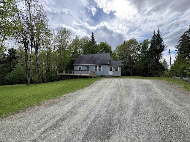 10 Youngs Rd, East Haven, VT 05837 - view of front of property featuring driveway, a deck, and a front yard