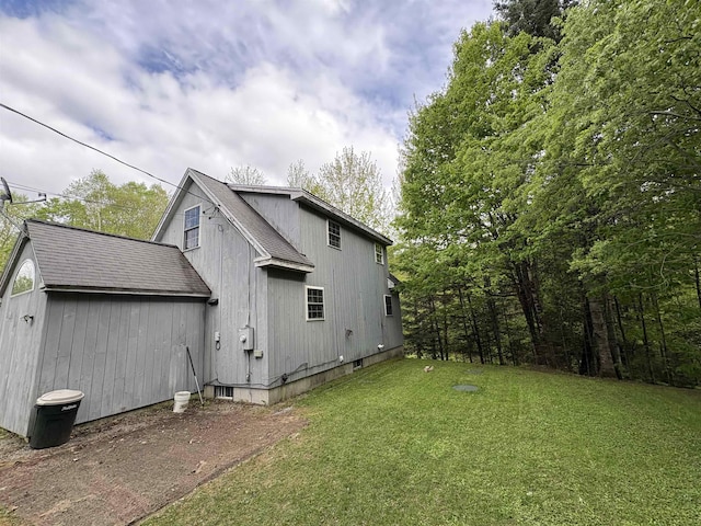 10 Youngs Rd, East Haven, VT 05837 - back of house featuring a yard and roof with shingles