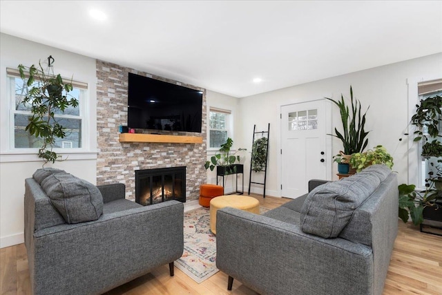 140 S Mast St, Goffstown, NH 03045 - living room with a brick fireplace, light wood-type flooring, baseboards, and recessed lighting