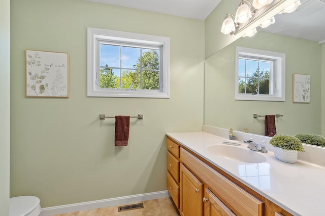 19 Steeple Chase Dr, Hampstead, NH 03841 - bathroom featuring vanity, toilet, plenty of natural light, and baseboards