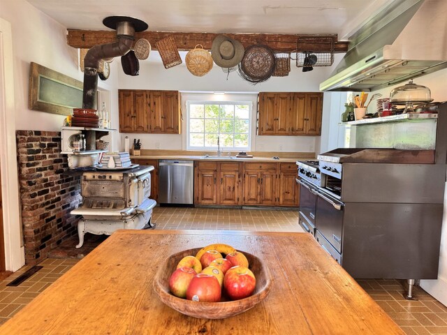 9671 Vt Route 12, Barnard, VT 05031 - kitchen featuring appliances with stainless steel finishes, exhaust hood, brick patterned flooring, brown cabinets, and butcher block countertops