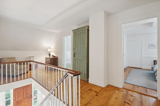 9671 Vt Route 12, Barnard, VT 05031 - hallway featuring light wood-style flooring, an upstairs landing, lofted ceiling, and baseboards