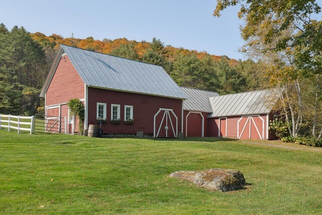 9671 Vt Route 12, Barnard, VT 05031 - view of barn featuring a wooded view and a garage
