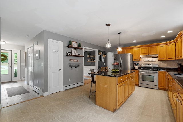 24 Stonewall Dr, Milford, NH 03055 - kitchen featuring stainless steel appliances, a baseboard radiator, under cabinet range hood, a breakfast bar area, and a center island