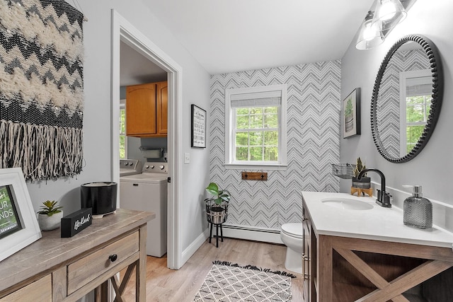 24 Stonewall Dr, Milford, NH 03055 - bathroom with an accent wall, baseboard heating, wallpapered walls, washer and clothes dryer, and toilet