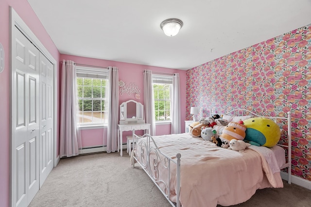 24 Stonewall Dr, Milford, NH 03055 - bedroom with wallpapered walls, light colored carpet, a closet, baseboards, and a baseboard heating unit