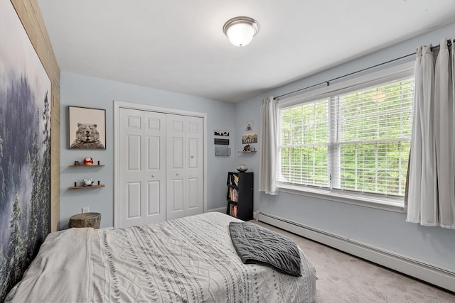 24 Stonewall Dr, Milford, NH 03055 - bedroom featuring a baseboard heating unit, a closet, and carpet flooring