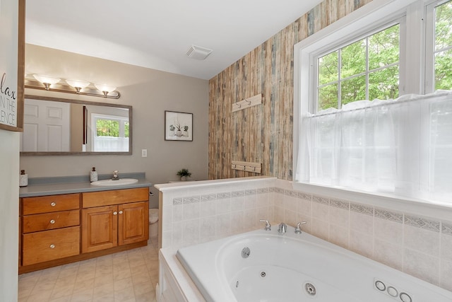 24 Stonewall Dr, Milford, NH 03055 - bathroom featuring a whirlpool tub and vanity