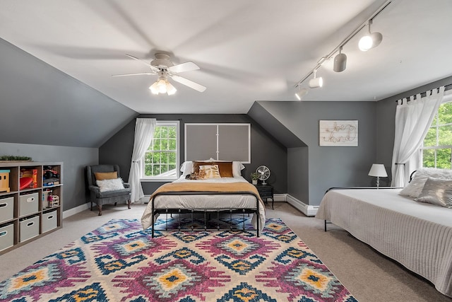 24 Stonewall Dr, Milford, NH 03055 - bedroom with carpet floors, multiple windows, rail lighting, ceiling fan, and vaulted ceiling