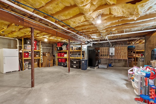 24 Stonewall Dr, Milford, NH 03055 - unfinished basement featuring freestanding refrigerator and electric panel
