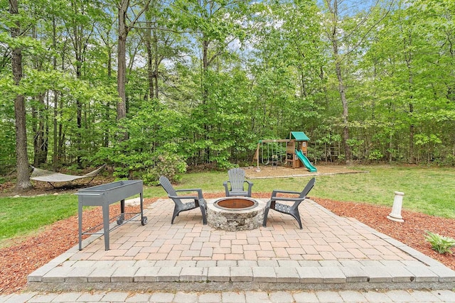 24 Stonewall Dr, Milford, NH 03055 - view of patio / terrace with a fire pit and a playground