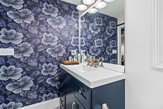 31 Henderson Rd Unit 17, Gilford, NH 03249 - bathroom with wallpapered walls and vanity