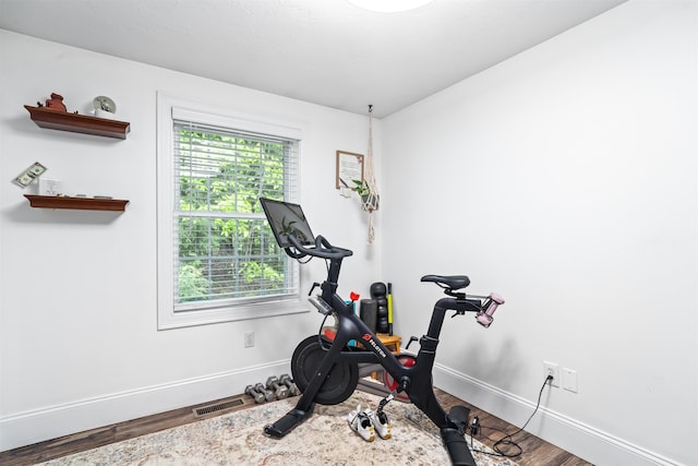 31 Henderson Rd Unit 17, Gilford, NH 03249 - exercise room featuring wood finished floors and baseboards