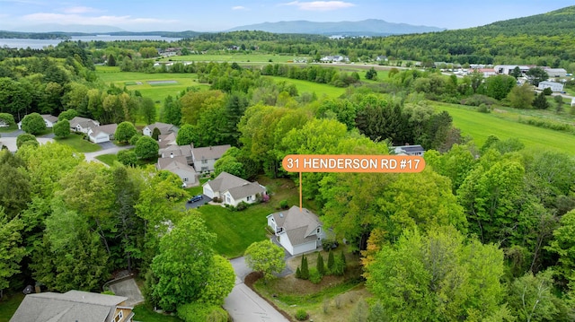 31 Henderson Rd Unit 17, Gilford, NH 03249 - drone / aerial view of a mountainous background and a heavily wooded area