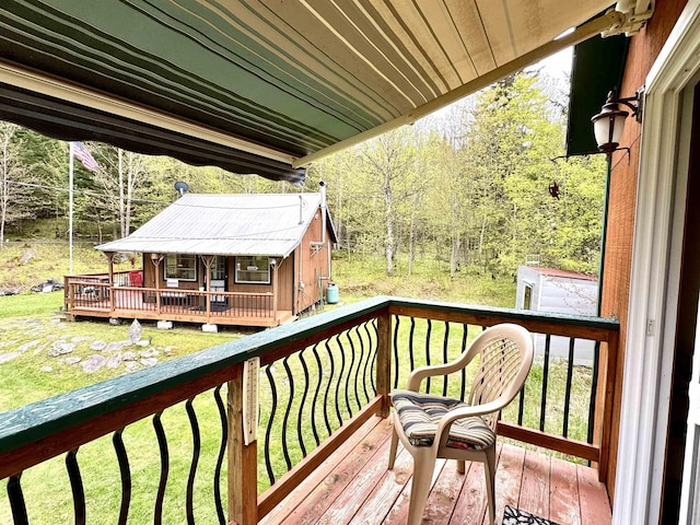 106 Philbrook Rd, Pittsburg, NH 03592 - wooden terrace with a lawn and a view of trees
