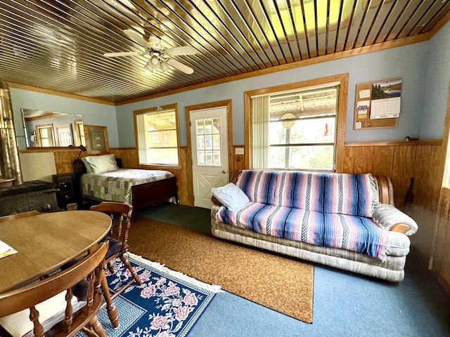 106 Philbrook Rd, Pittsburg, NH 03592 - carpeted bedroom with wood walls, a wainscoted wall, and wood ceiling