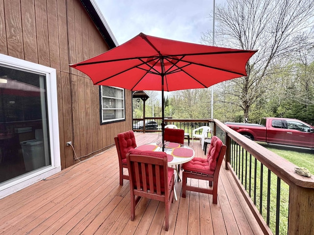 106 Philbrook Rd, Pittsburg, NH 03592 - wooden deck with outdoor dining area and a yard