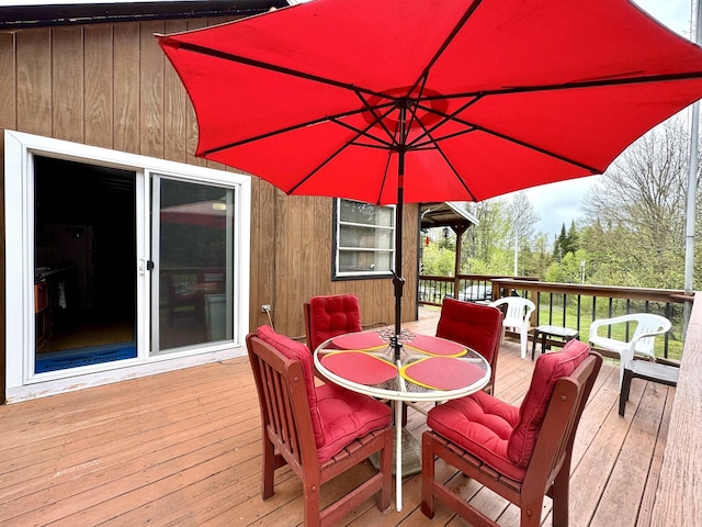 106 Philbrook Rd, Pittsburg, NH 03592 - wooden terrace with outdoor dining area