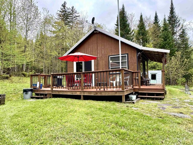 106 Philbrook Rd, Pittsburg, NH 03592 - back of house with a lawn and a wooden deck