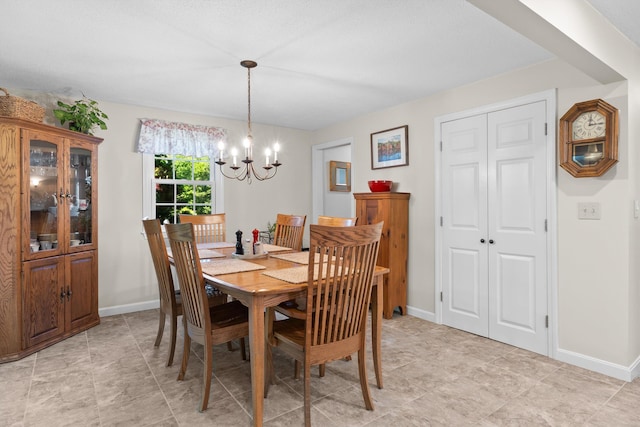 37 Forest St, Londonderry, NH 03053 - dining room with a chandelier and baseboards