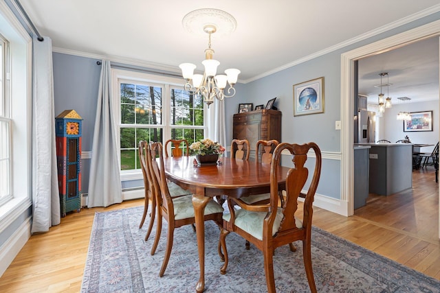 15 Fox Meadow Ln, Merrimack, NH 03054 - dining area with a chandelier, light wood-style floors, ornamental molding, and baseboards