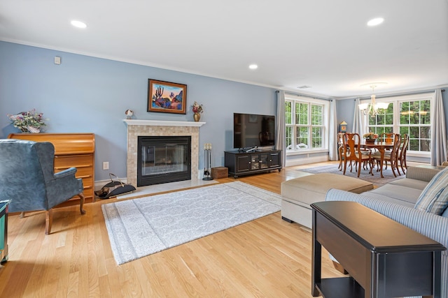 15 Fox Meadow Ln, Merrimack, NH 03054 - living room featuring wood finished floors, ornamental molding, a chandelier, recessed lighting, and a fireplace