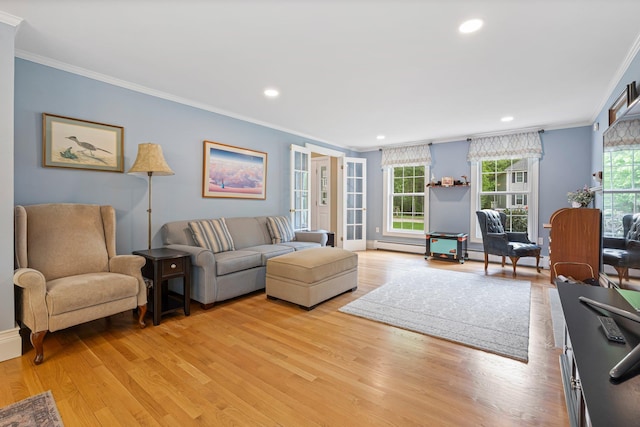 15 Fox Meadow Ln, Merrimack, NH 03054 - living area with crown molding, plenty of natural light, baseboard heating, light wood-style flooring, and recessed lighting