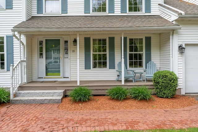 15 Fox Meadow Ln, Merrimack, NH 03054 - property entrance featuring a porch, roof with shingles, and an attached garage