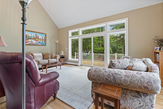 15 Fox Meadow Ln, Merrimack, NH 03054 - living room featuring a baseboard heating unit, light wood-type flooring, and high vaulted ceiling