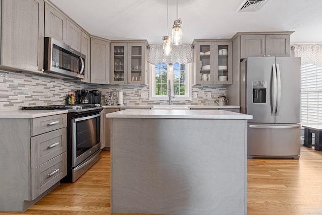 15 Fox Meadow Ln, Merrimack, NH 03054 - kitchen featuring stainless steel appliances, gray cabinets, a sink, and backsplash