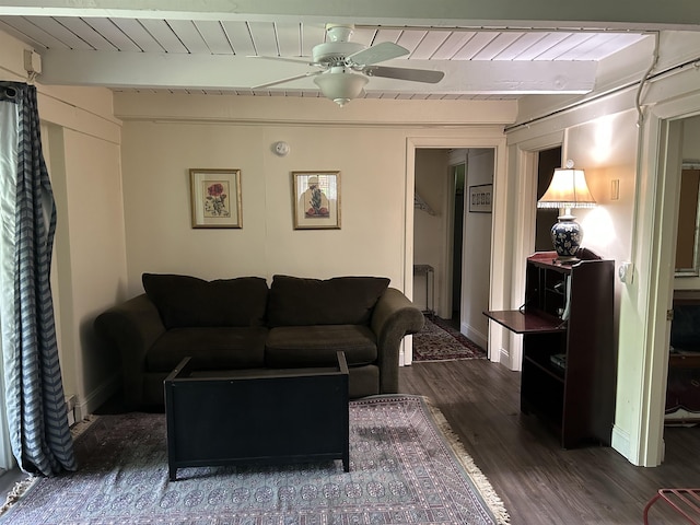 19 Alpendorf Loop, Bartlett, NH 03812 - living area with dark wood finished floors, wood ceiling with exposed beams, a ceiling fan, and baseboards