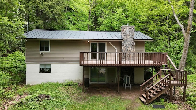 19 Alpendorf Loop, Bartlett, NH 03812 - rear view of house featuring a standing seam roof, stairway, a deck, and metal roof