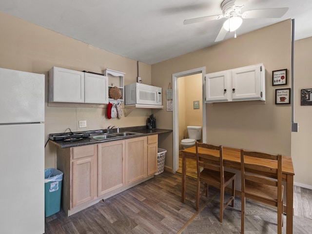 450 Leighton Corner Rd, Wakefield, NH 03872 - kitchen featuring white appliances, a sink, dark wood finished floors, and dark countertops