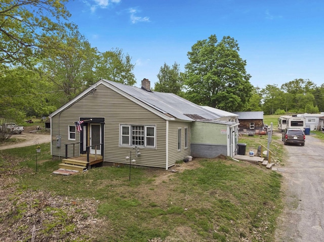 450 Leighton Corner Rd, Wakefield, NH 03872 - bungalow-style house with a chimney and a front yard