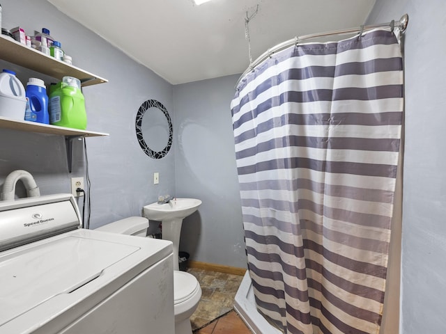 450 Leighton Corner Rd, Wakefield, NH 03872 - bathroom with washer / dryer, toilet, curtained shower, and stone finish flooring