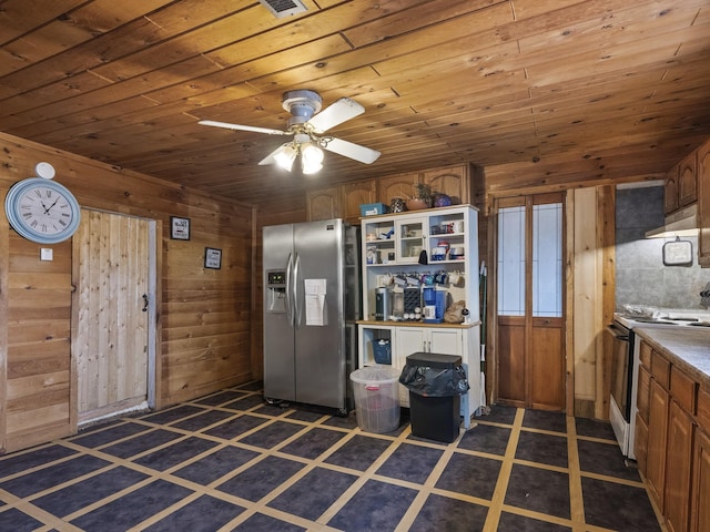 450 Leighton Corner Rd, Wakefield, NH 03872 - kitchen with stainless steel fridge with ice dispenser, range with electric cooktop, ceiling fan, wood walls, and wood ceiling