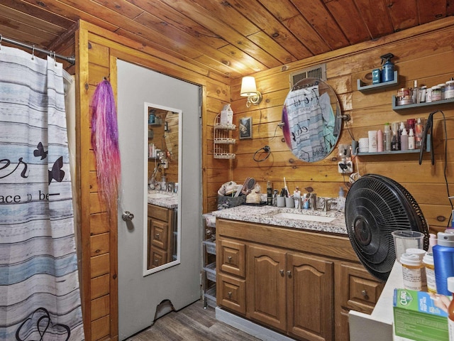 450 Leighton Corner Rd, Wakefield, NH 03872 - bathroom with wooden ceiling, vanity, wood finished floors, wooden walls, and a shower with curtain