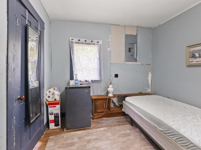 450 Leighton Corner Rd, Wakefield, NH 03872 - bedroom featuring electric panel and light wood finished floors