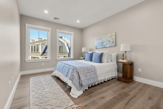 33 Little Bay Dr, Dover, NH 03820 - bedroom featuring wood finished floors, baseboards, and recessed lighting